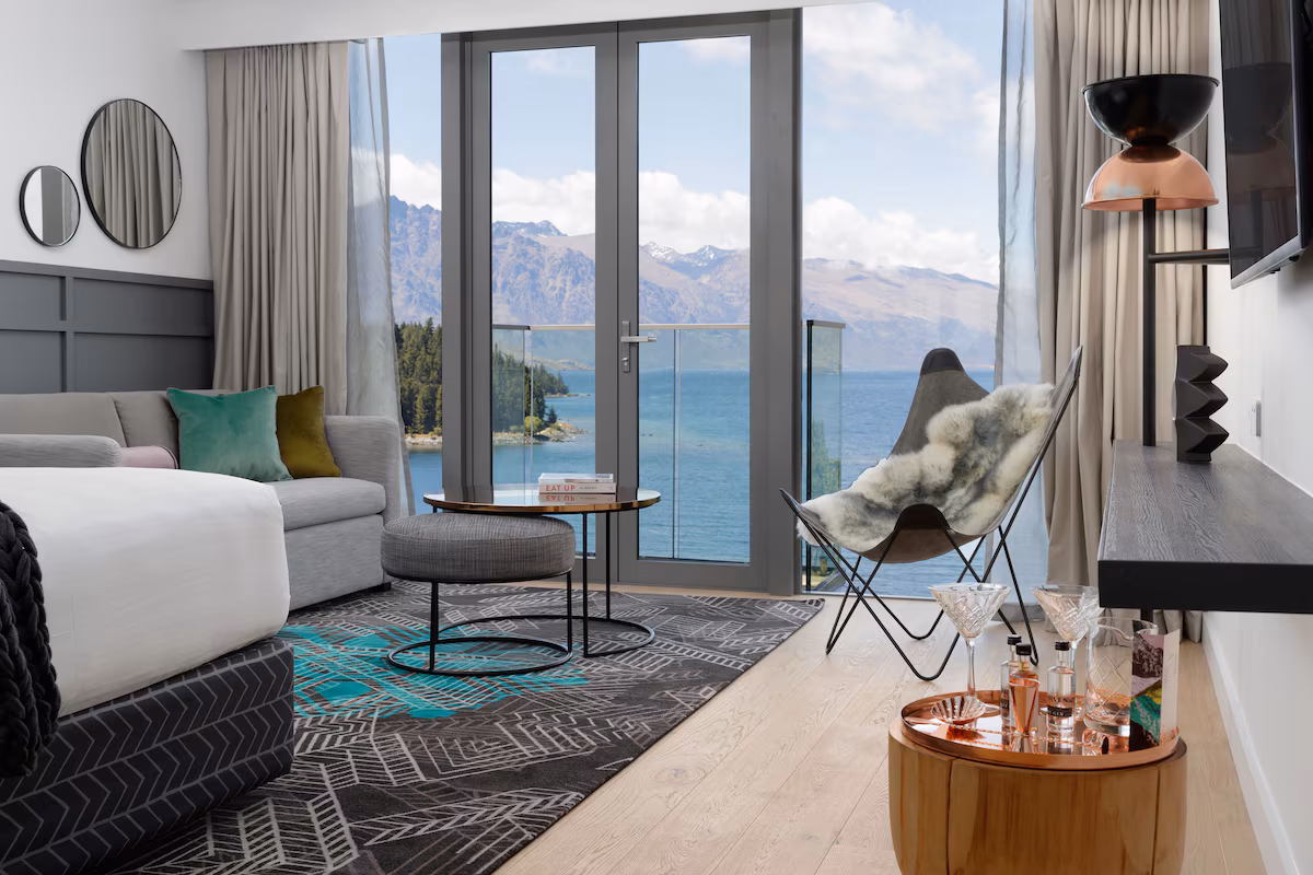 Luxury QT Queenstown hotel room with a view over the snowy mountains and lake